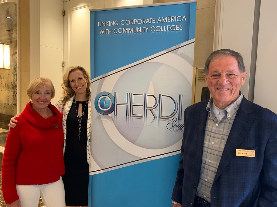 Jim Catanzaro, Toni Cleveland and Kathy Roman with HERDI sign