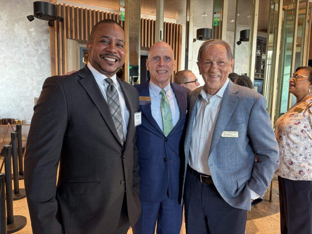 Jim Catanzaro, John Sygielski, and client partner Bacari Brown at the reception in Seattle. 